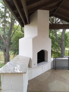 White Venetian Plaster Fireplace over brown flagstone.